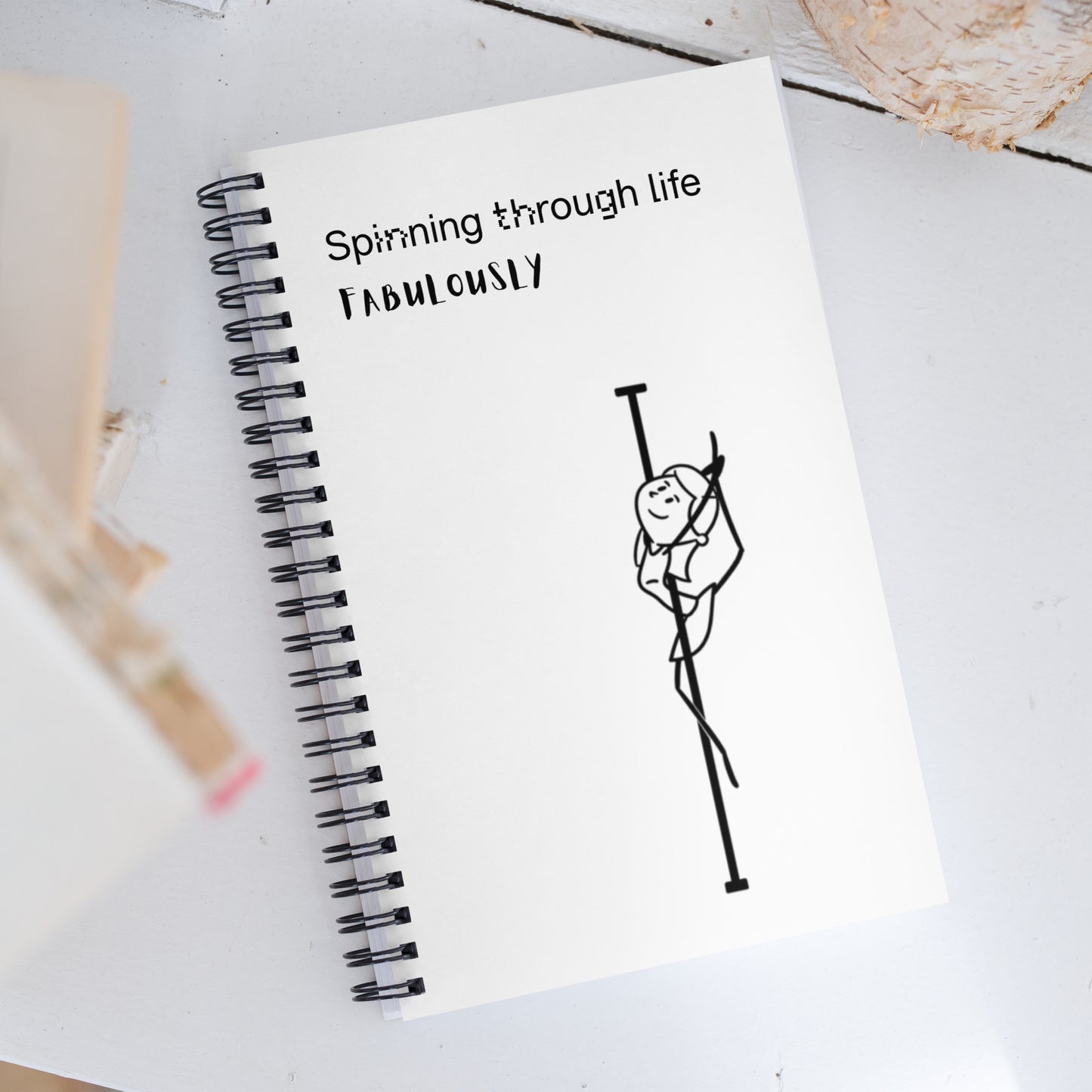 Spiral-bound pole dance notebook ideal for tracking routines, goals, and inspiration.