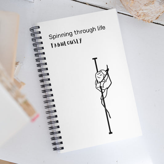 Spiral-bound pole dance notebook ideal for tracking routines, goals, and inspiration.